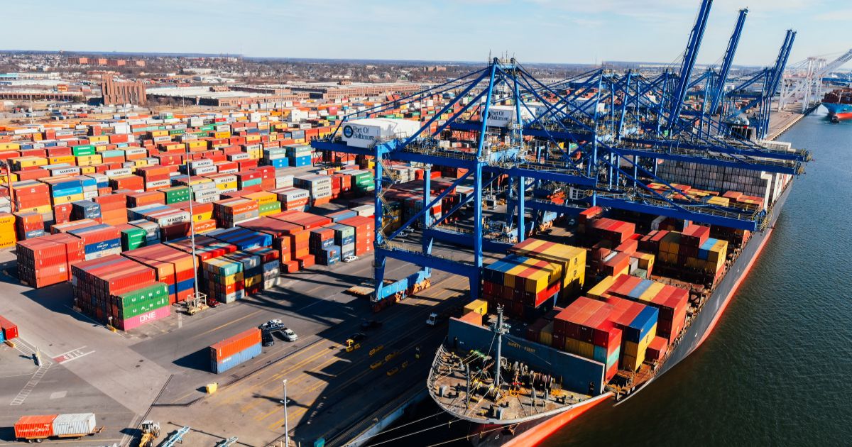 A port with shipping containers on a ship