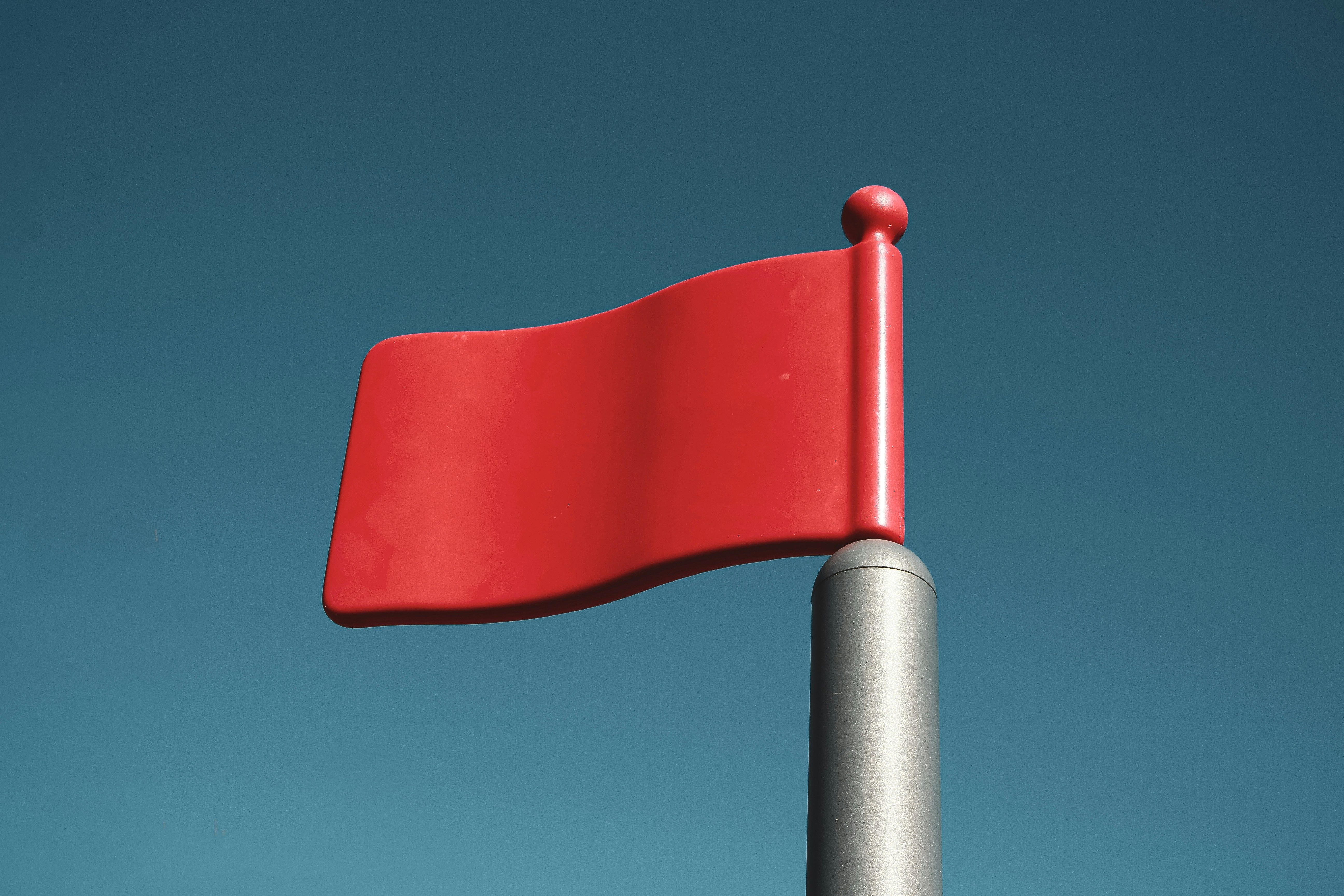 A red flag warning against a threat