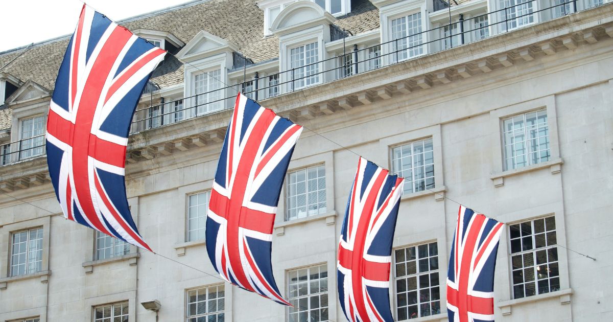 A row of Union Flags between two buildings