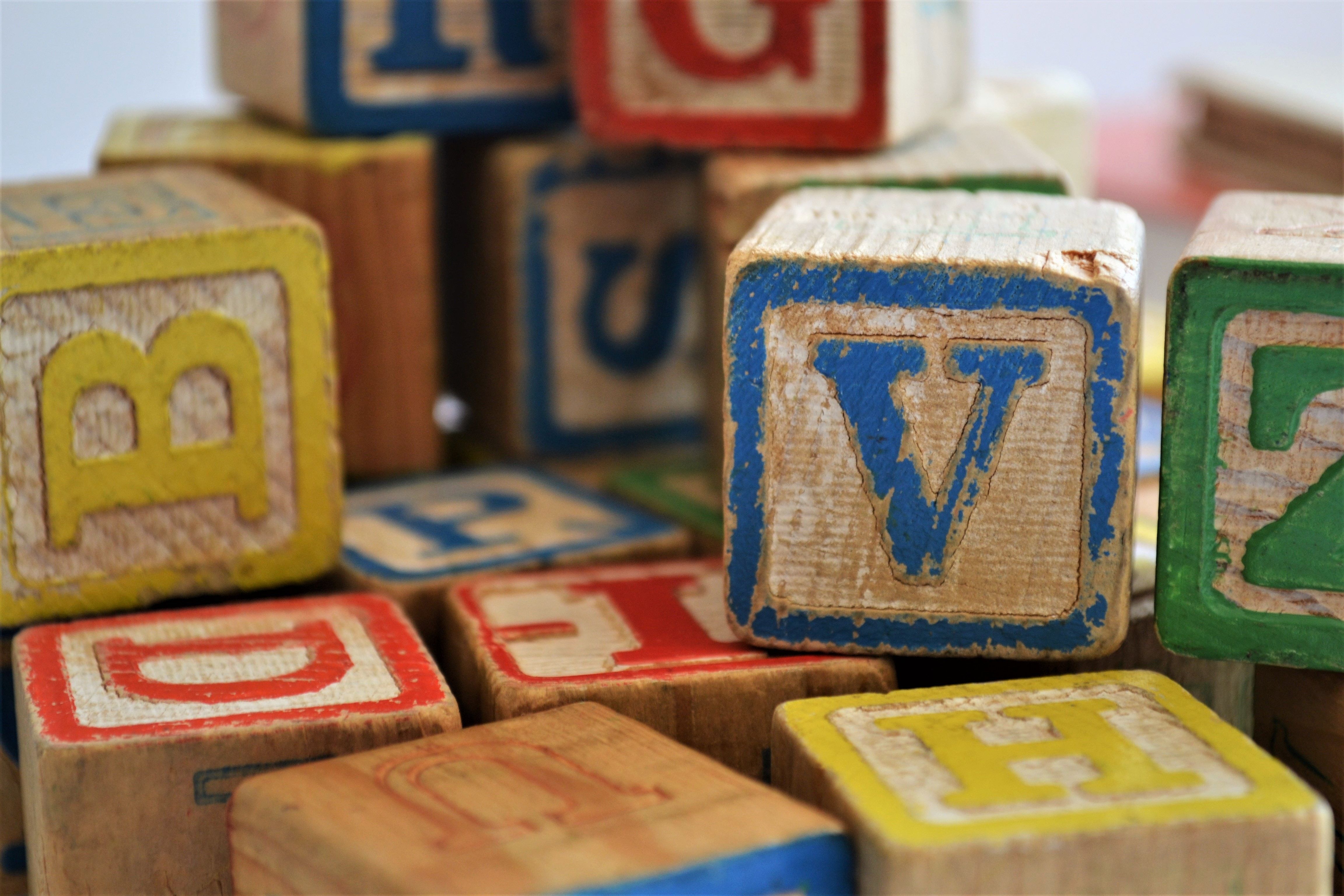 building block letters stacked in a pile