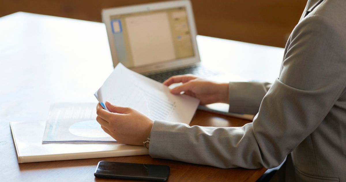 Corporate worker looking at documents