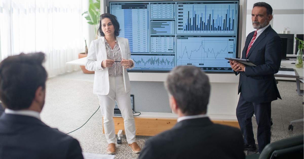 Man and a woman presenting in smart clothes
