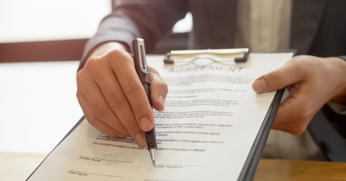 Man with a pen and clipboard