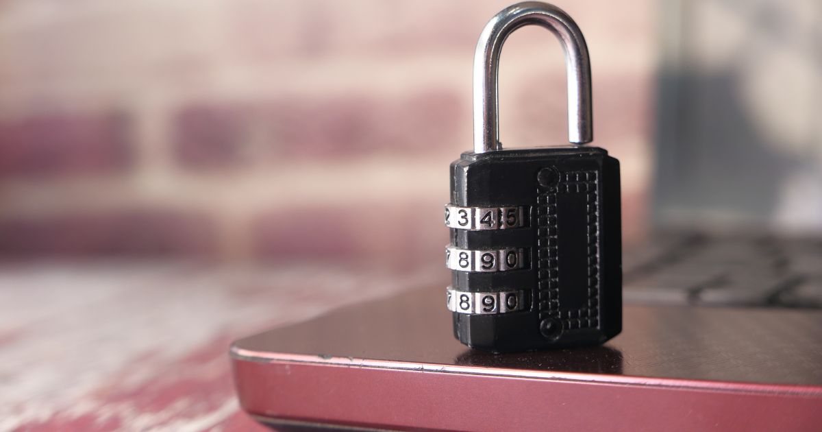 Padlock resting on top of a laptop