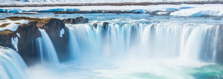 Beauty of Iceland captured in a waterfall and surrounded by snow
