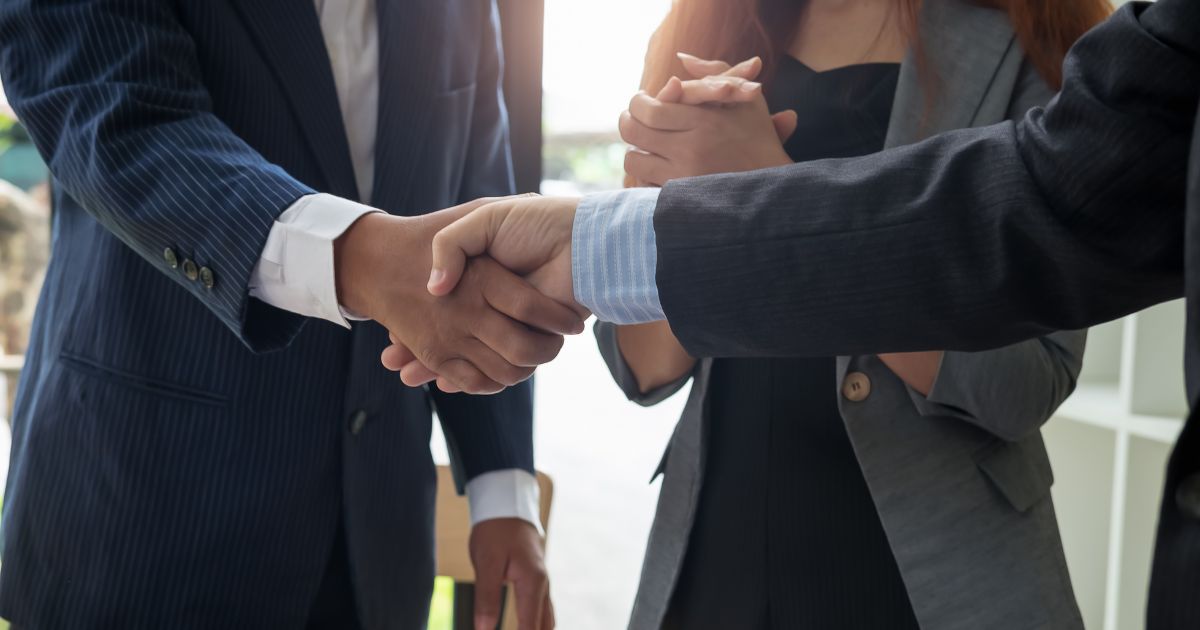 Man shaking hands as part of a deal