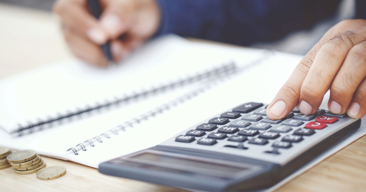 Tax advisor using a calculator