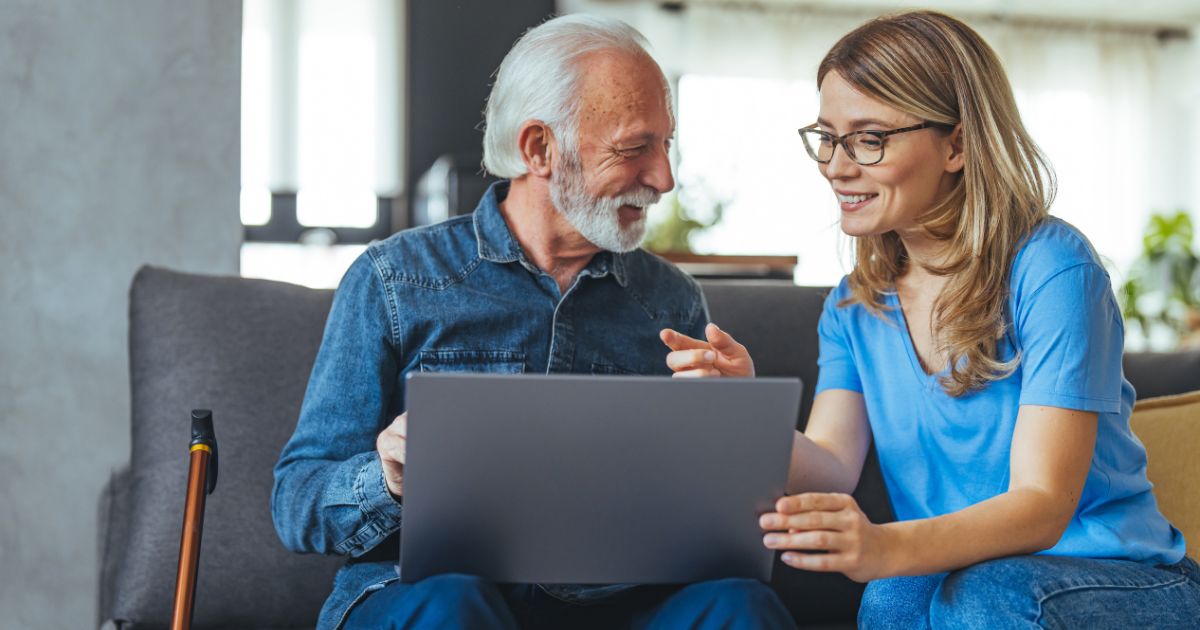 Woman helping an elderly person